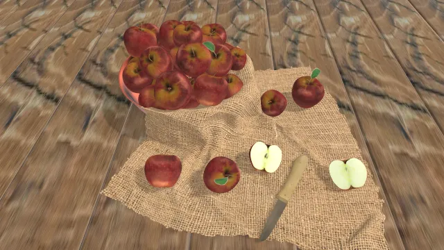 桌子上的放在水果盆里的苹果有刀叉餐布食物