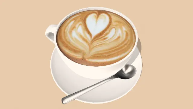 一杯拉花咖啡放有勺子饮品