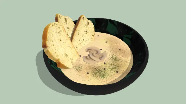 一碗浓汤泡有面包蘑菇片食物