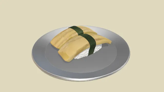 放在铁盘子里的玉子寿司食物