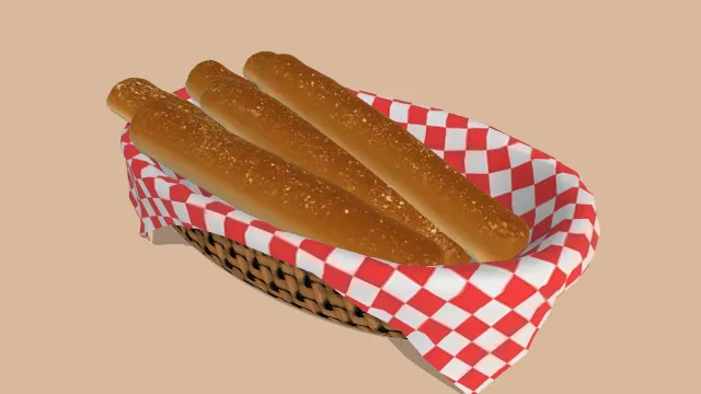 面包棒烘焙食物放在餐布装饰的篮子里