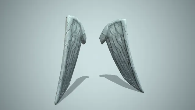 有点破损的绿色的翅膀雕塑